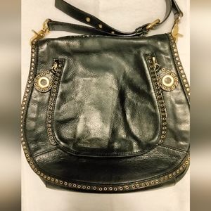 Rebecca Minkoff black purse trimmed in gold detailed hardware